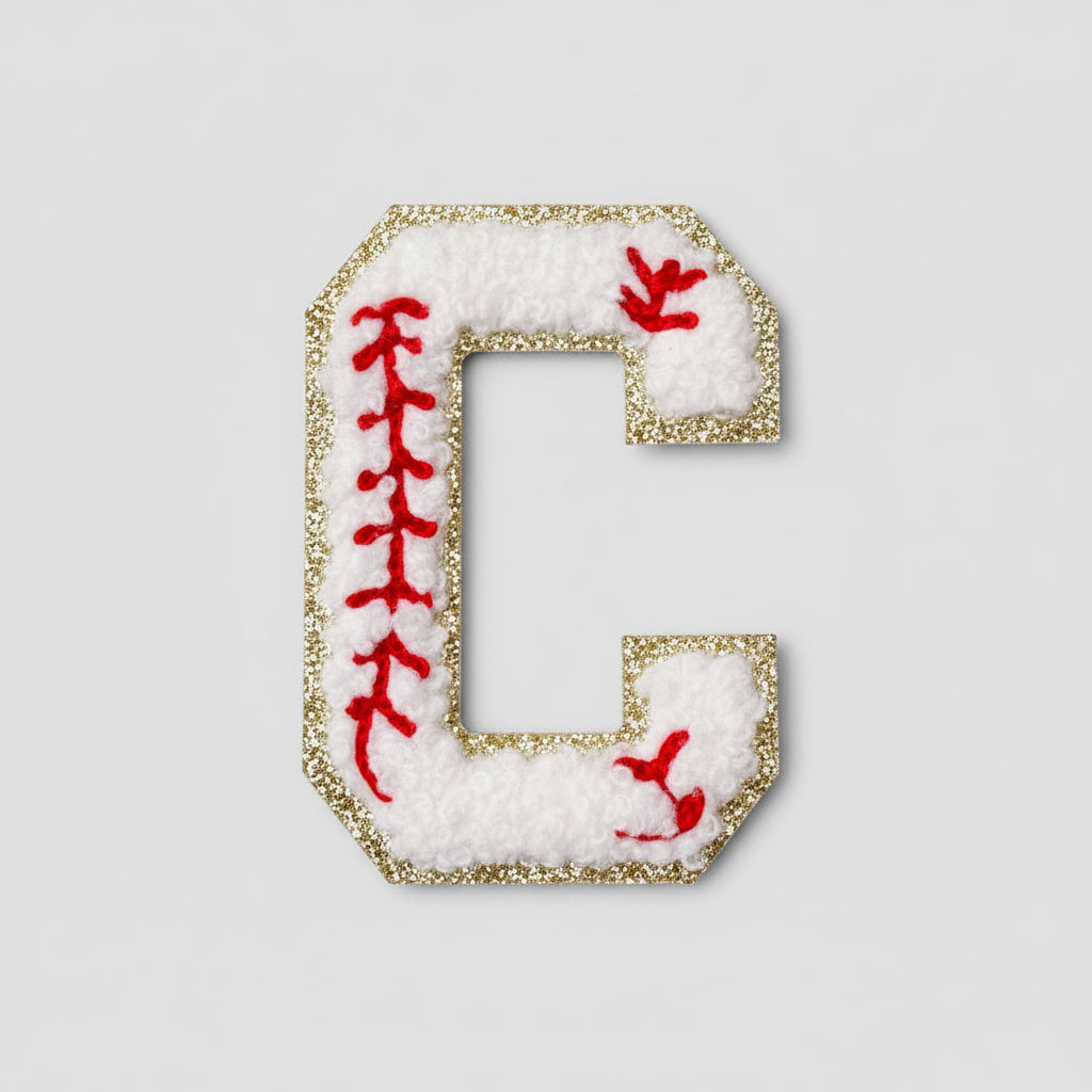 Embroidered letter 'C' patch on a textured fabric background